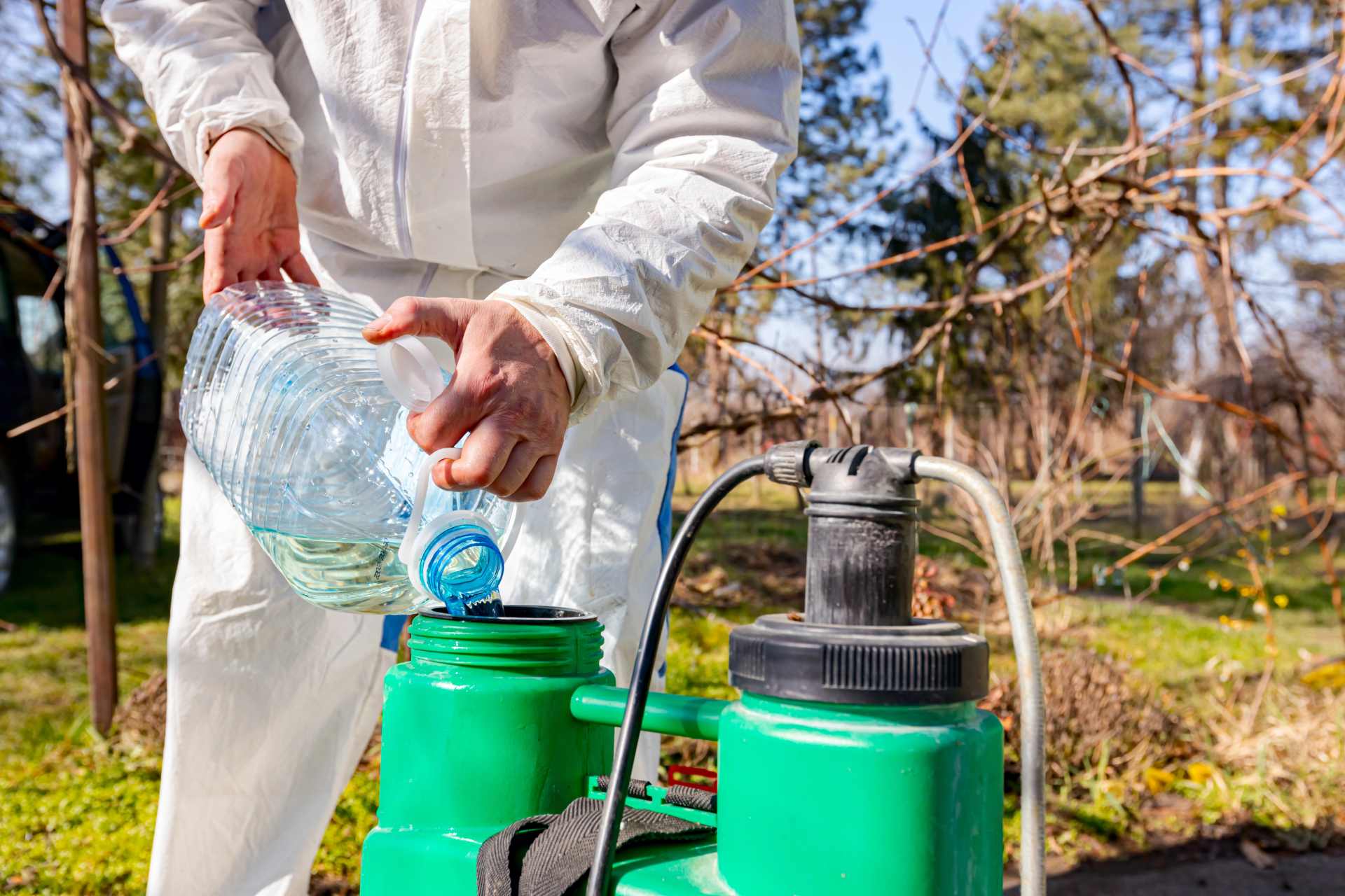A scientist mixing a trial batch of herbicide.