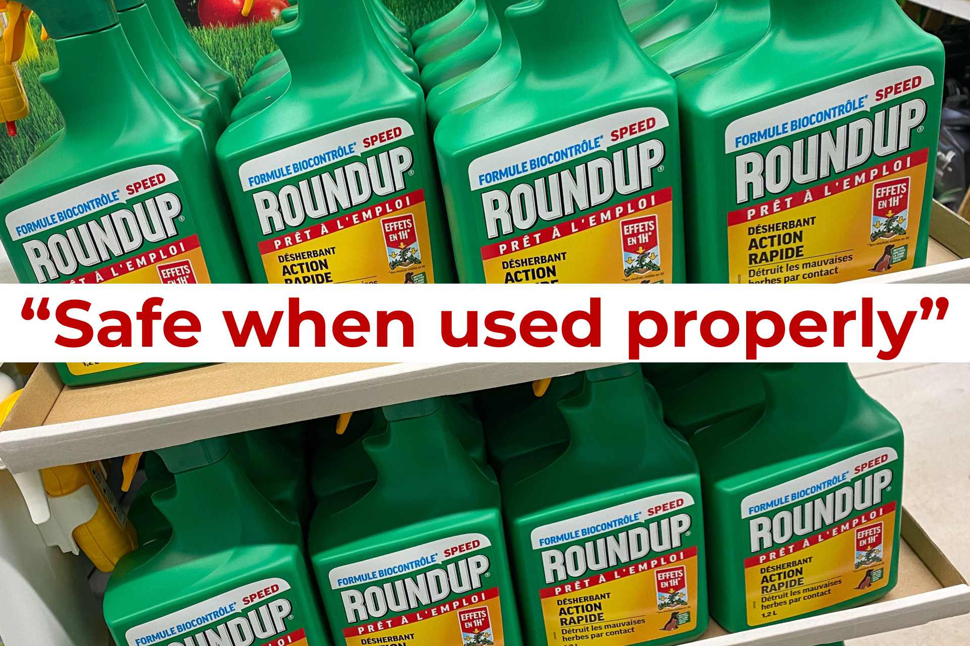 Retail shelf displaying bottles of Roundup weedkiller, with a bold banner reading “Safe when used properly” across the center—highlighting the marketing phrase under scrutiny