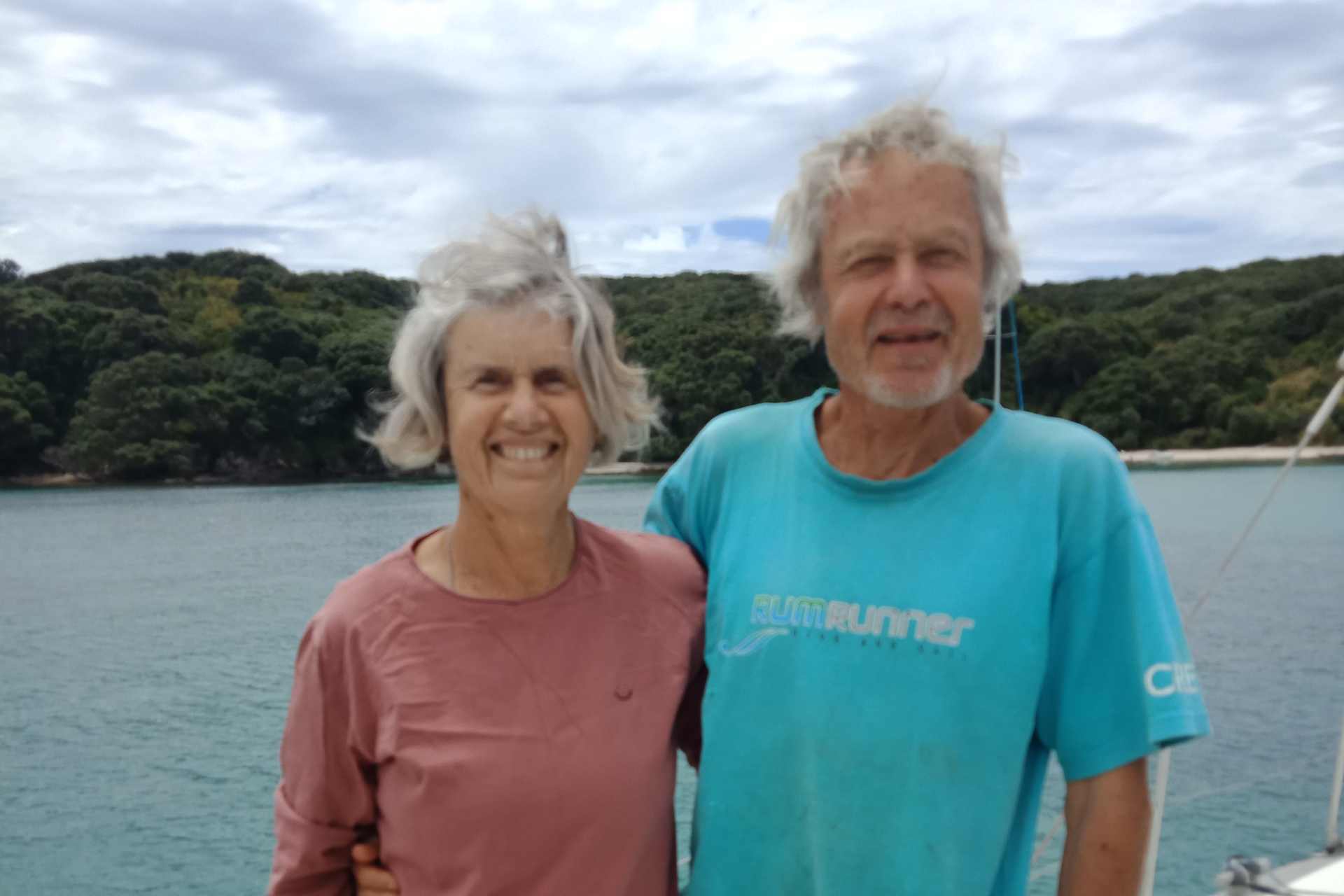Robyn and her husband smiling onboard their boat — sharing their personal journey with glyphosate exposure and recovery.