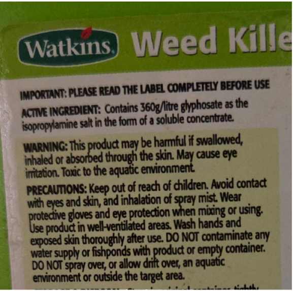 Close up of Watkins commercial strength weedkiller label showing active ingredient, warnings and precautions.