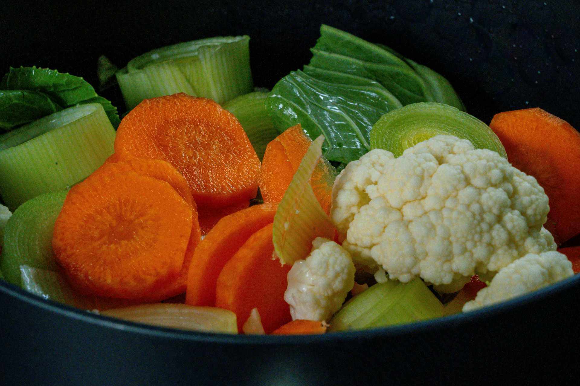Fresh vegetables prepared and ready for cooking, illustrating everyday meal preparation before heat is applied.