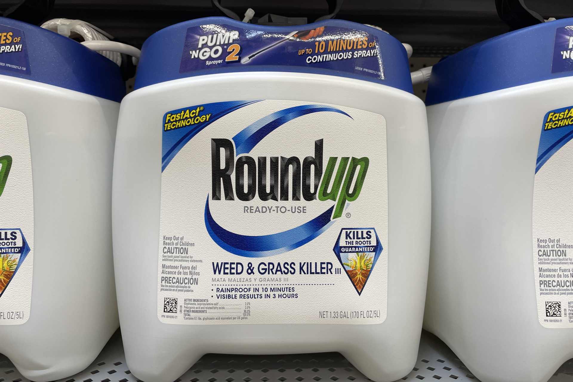 Close-up of a large Roundup glyphosate herbicide container on a retail shelf, as legal liability protections for Monsanto are strengthened by the US Supreme Court.